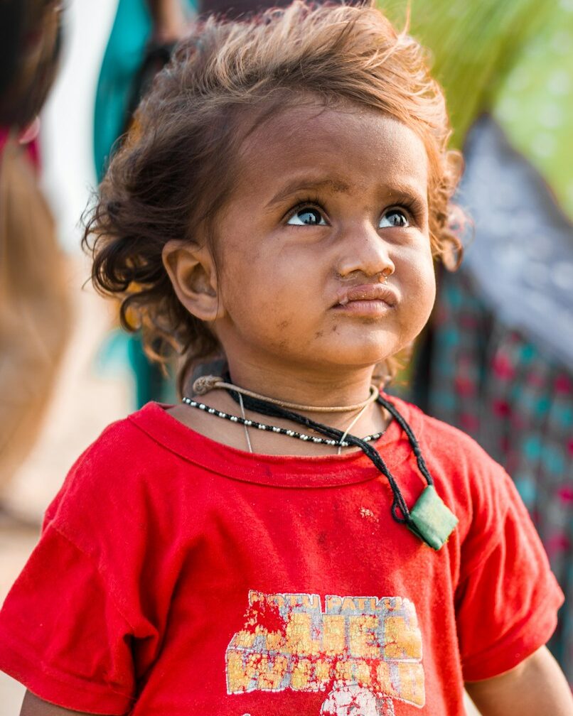 a young girl with a red shirt